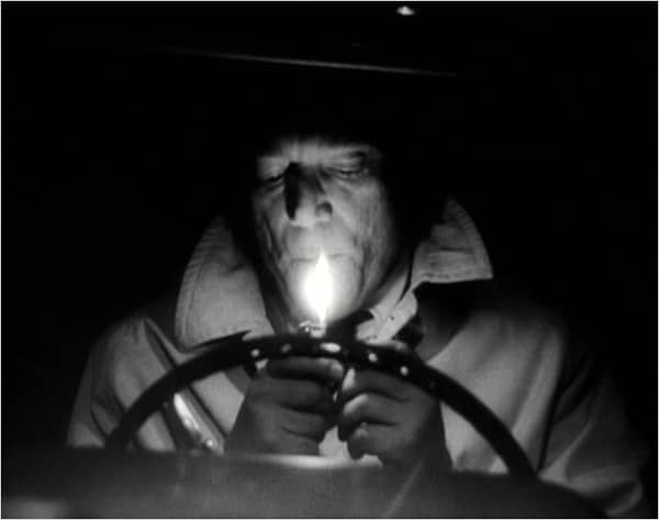 Eddie Constantine dans Alphaville de JL Godard in Voyage dans le cinéma français de Bertrand Tavernier